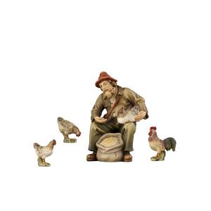 RA Shepherd sitting with hen