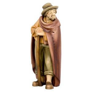 Pastore in piedi con bastone