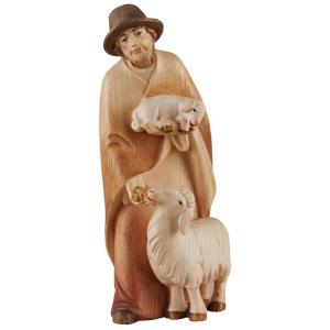 Shepherd with salt sheep and lamb