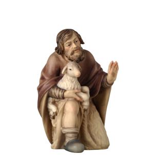 Pastore inginochiato con capra