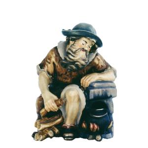 Shepherd sitting at the fire