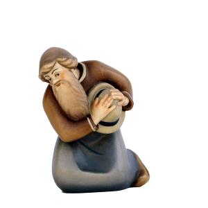 Shepherd kneeling with hat