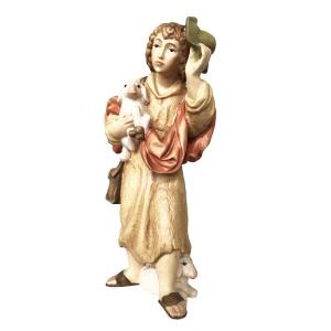 Pastore con cappello che cura le sue pecore