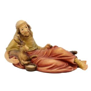 Pastore sdraiato con capra