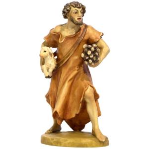 Pastore con legna e agnello