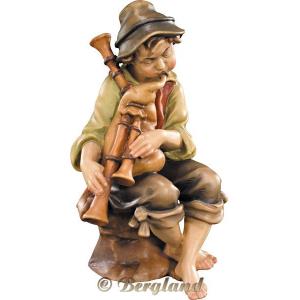 Herdsman sitting with bagpipe