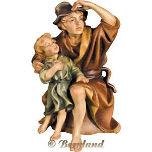 Herdsman sitting with kid